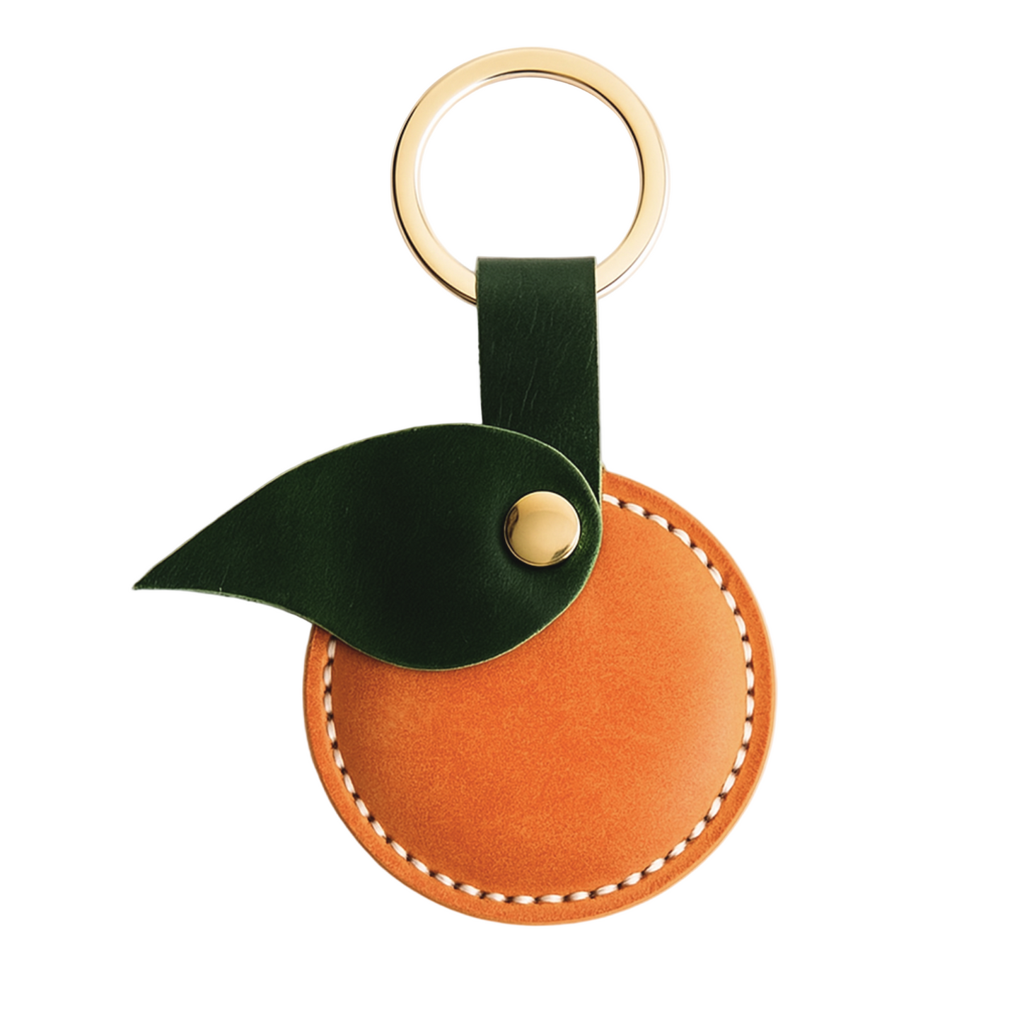 Leather keychain with green leaf and gold ring on a white background