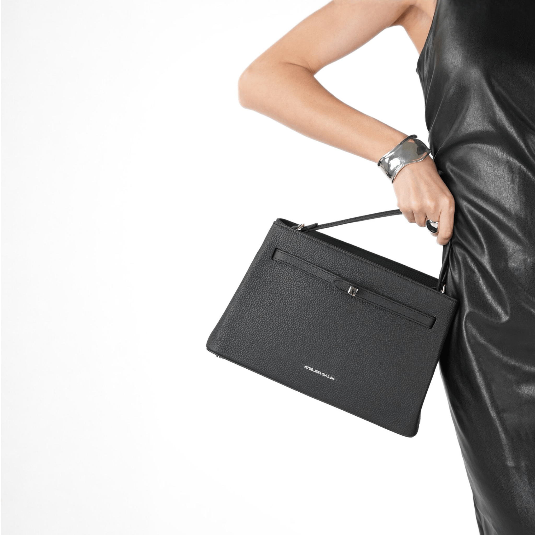 Black atelier galin cube lock handbag with silver hardware and brand logo style 