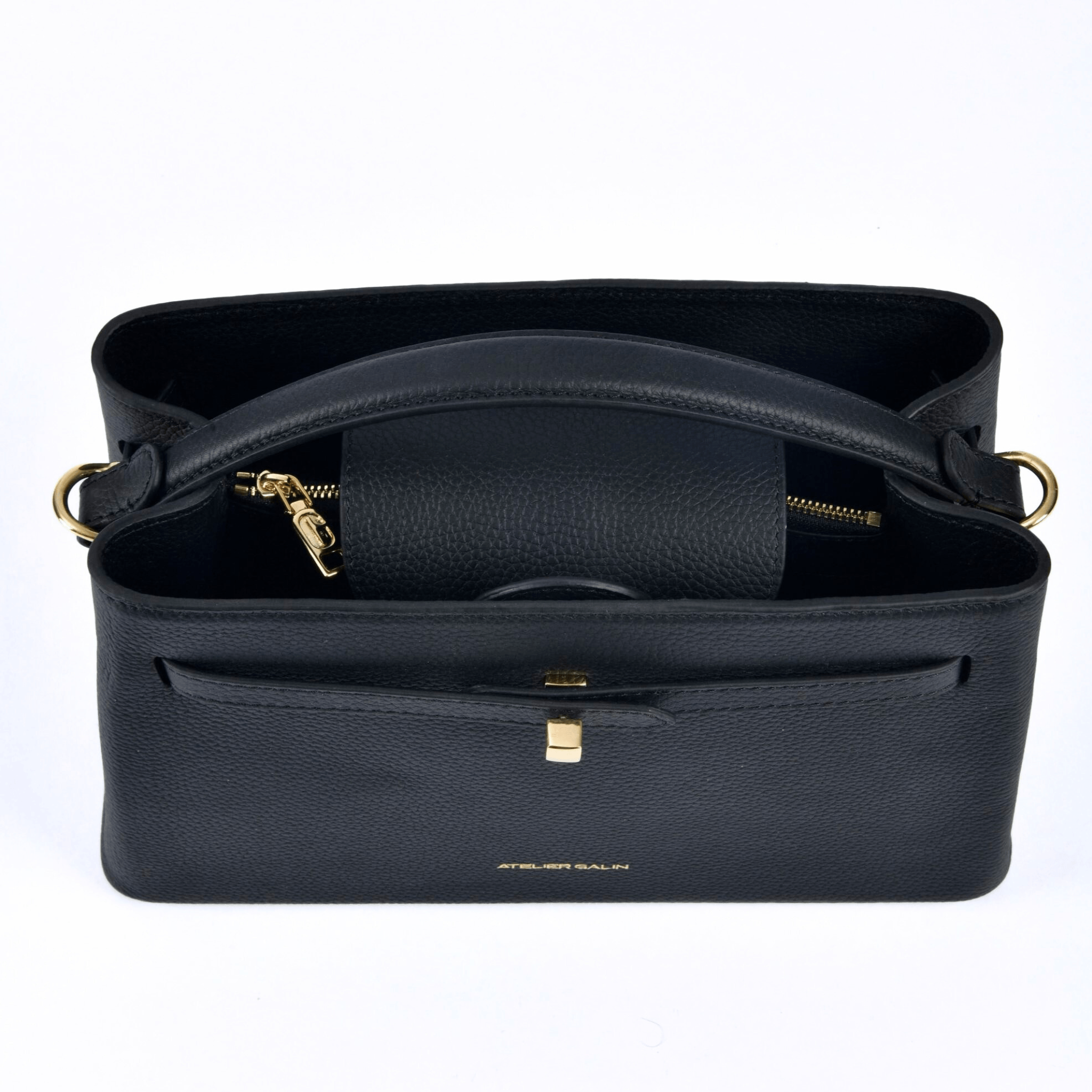 atelier galin cube lock handbag in black lwg gold certified grained leather and gold hardware top view with logo zipper pull and lock details