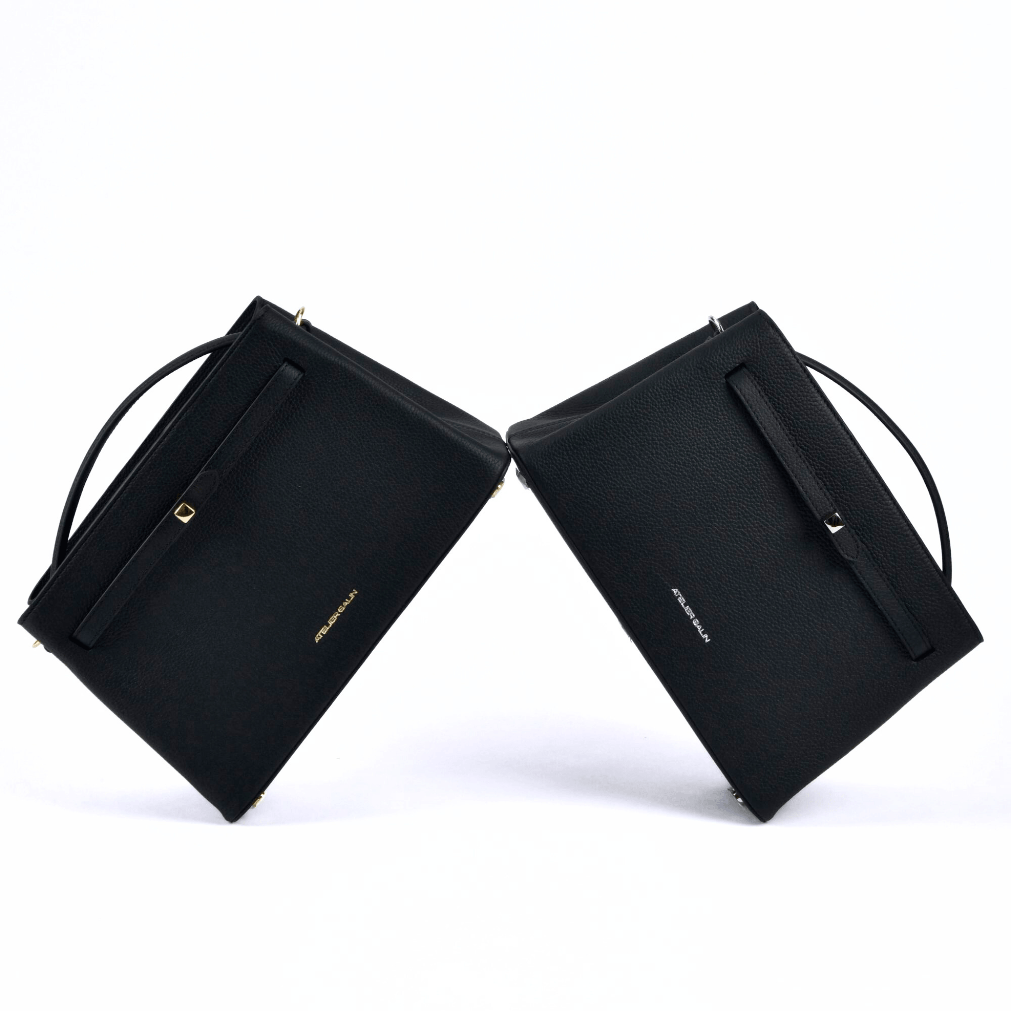 Black atelier galin cube lock handbags with silverand gold  hardware and brand logos 