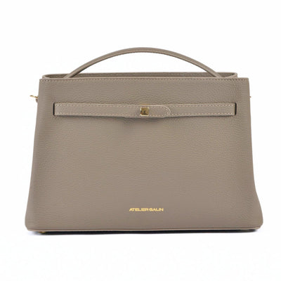 Beige atelier galin cube lock bag with 'Atelier Galin' branding on a white background