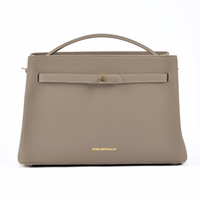 Beige atelier galin cube lock bag with 'Atelier Galin' branding on a white background