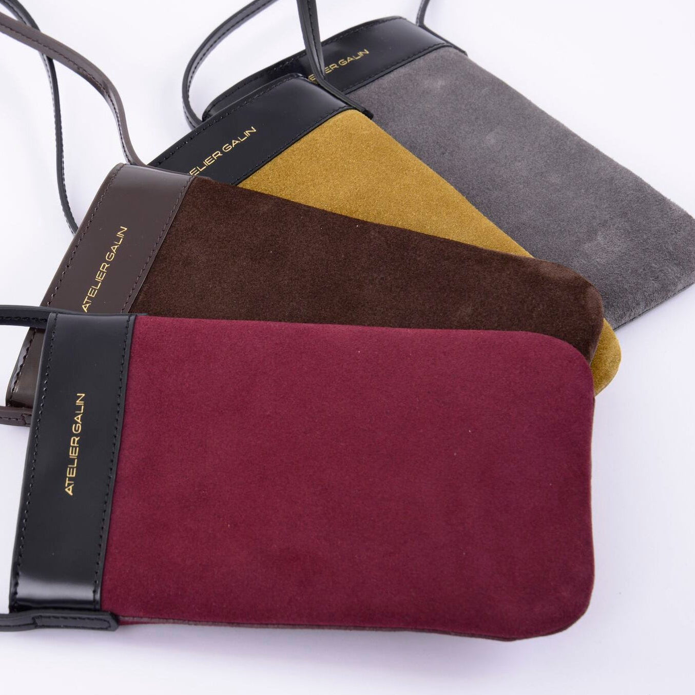 Color block suede PHONE BAGS with 'Atelier Galin' branding on a white background