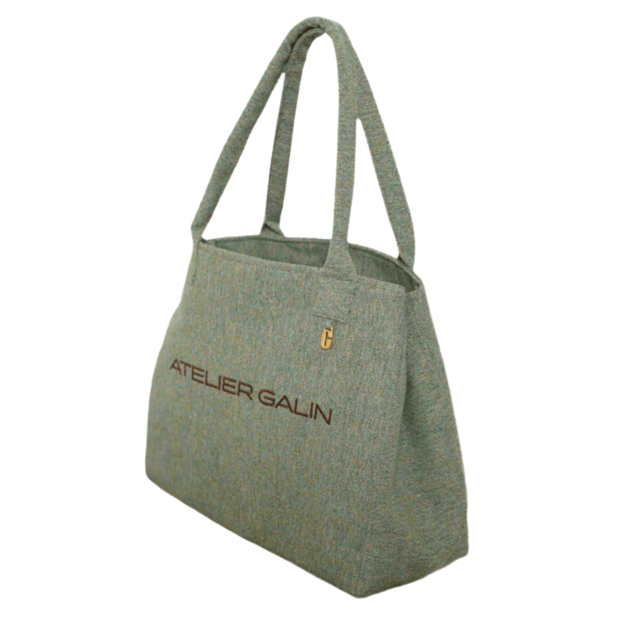 Green woven tote bag with 'Atelier Galin' embroidered branding on a white background